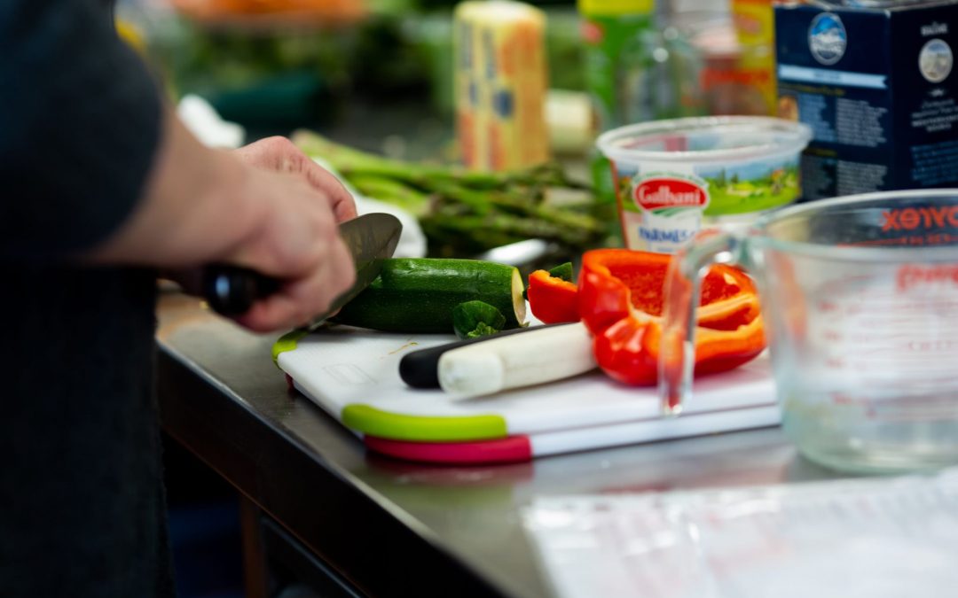 person chopping vegetables