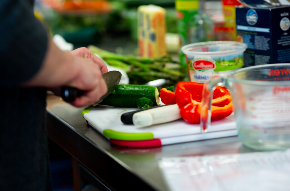 person chopping vegetables