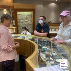 Two individuals stand at the counter of Braunschweiger Jewelers in Morristown. A woman greets them behind the counter.