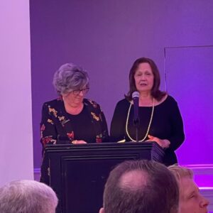 VLANJ Program Director Linda Groszew and Program Participant and author of the Blind Vine, Debbie Azzarone, speak at Dining in the Dark.