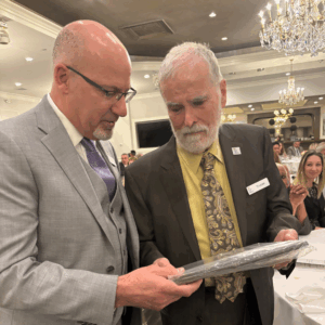 Carl Augusto, Board Chair and Bill Schuldt, VLANJ President and CEO are featured.